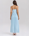 Nerina strapless pleated maxi dress with a structured bustier and seashell-pleated cups, fitted waist, and flowing pleated skirt. Soft, lightweight 100% polyester with subtle shine, ideal for resort dinners, beach weddings, and summer events.
