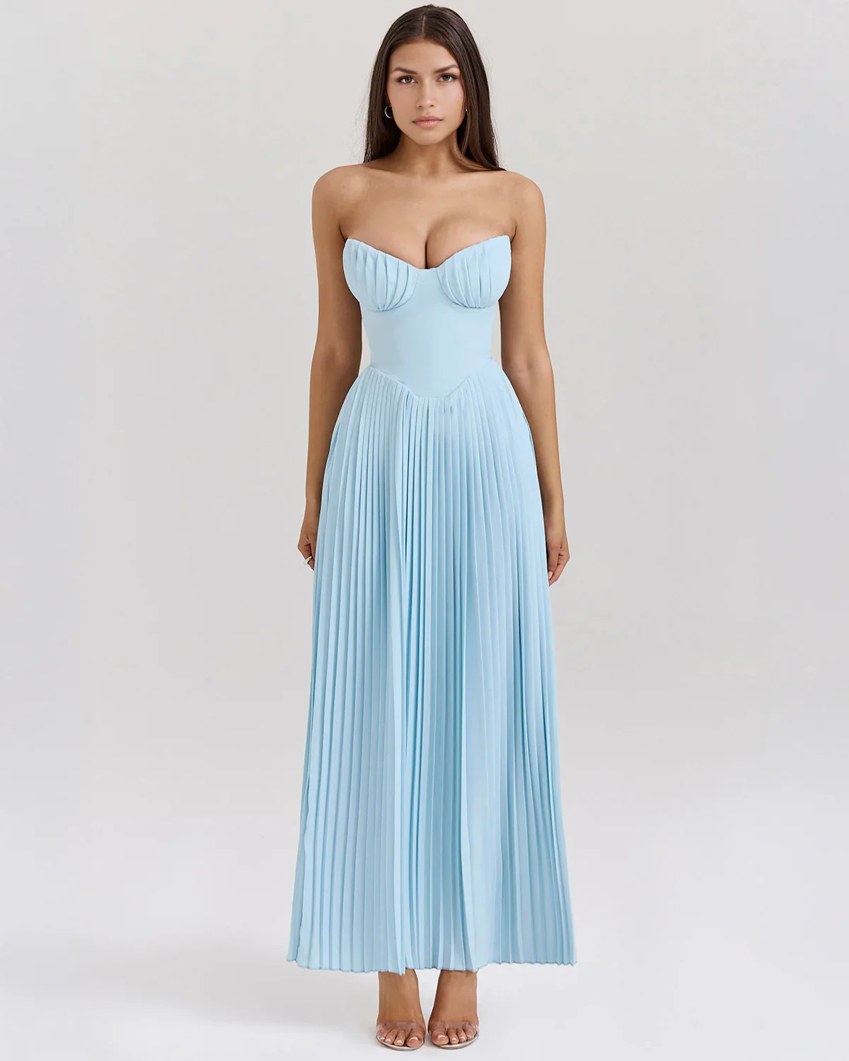 Nerina strapless pleated maxi dress with a structured bustier and seashell-pleated cups, fitted waist, and flowing pleated skirt. Soft, lightweight 100% polyester with subtle shine, ideal for resort dinners, beach weddings, and summer events.