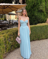 Nerina strapless pleated maxi dress with a structured bustier and seashell-pleated cups, fitted waist, and flowing pleated skirt. Soft, lightweight 100% polyester with subtle shine, ideal for resort dinners, beach weddings, and summer events.