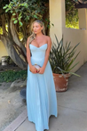 Nerina strapless pleated maxi dress with a structured bustier and seashell-pleated cups, fitted waist, and flowing pleated skirt. Soft, lightweight 100% polyester with subtle shine, ideal for resort dinners, beach weddings, and summer events.
