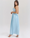 Nerina strapless pleated maxi dress with a structured bustier and seashell-pleated cups, fitted waist, and flowing pleated skirt. Soft, lightweight 100% polyester with subtle shine, ideal for resort dinners, beach weddings, and summer events.