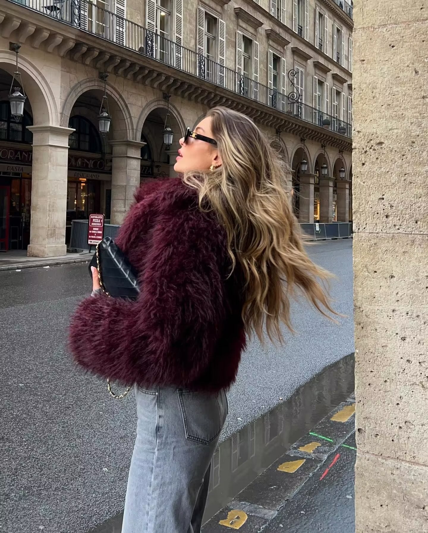 Cropped fluffy jacket in deep wine with a refined notch lapel and subtly voluminous sleeves. Plush, cosy texture and hip-skimming length create a chic layer over denim or evening dresses, adding warm, modern elegance for cooler days.