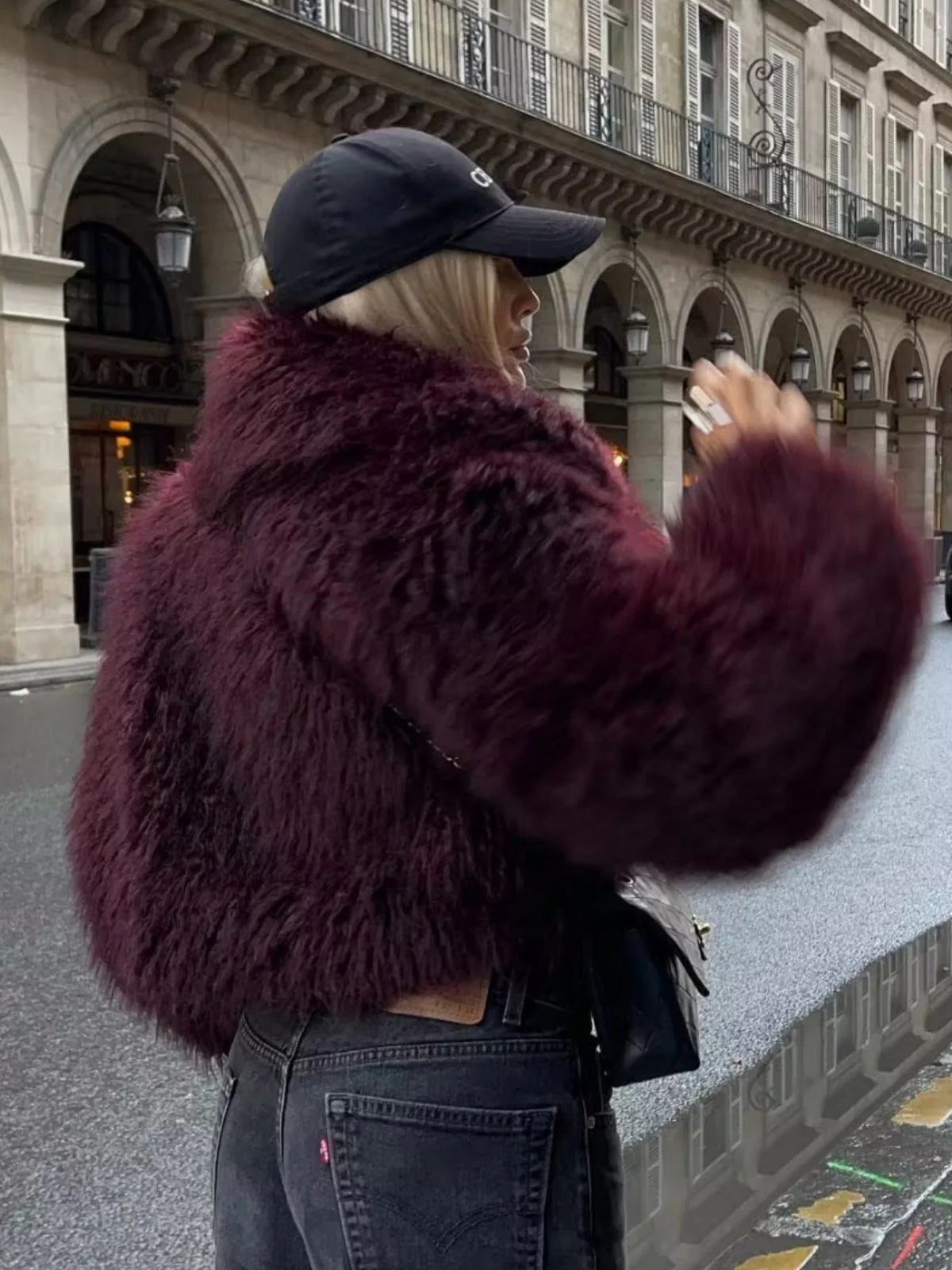 Cropped fluffy jacket in deep wine with a refined notch lapel and subtly voluminous sleeves. Plush, cosy texture and hip-skimming length create a chic layer over denim or evening dresses, adding warm, modern elegance for cooler days.