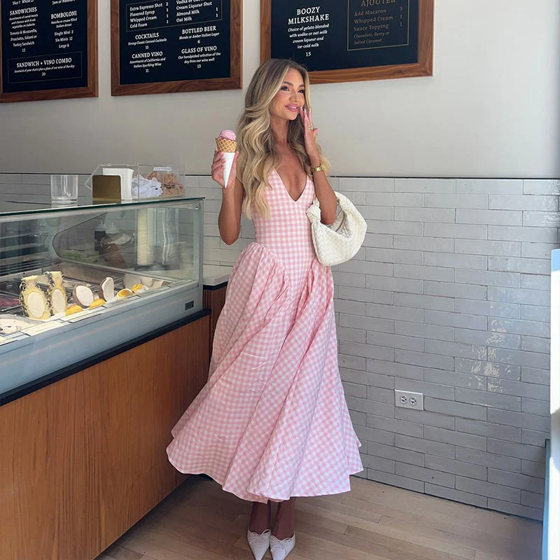 Romina Plaid Print Midi Dress in pink gingham featuring a deep V halter neckline with self-tie straps, fitted bodice with princess seams, and a full gathered midi skirt. Feminine, versatile silhouette ideal for brunch, garden parties and summer outings.