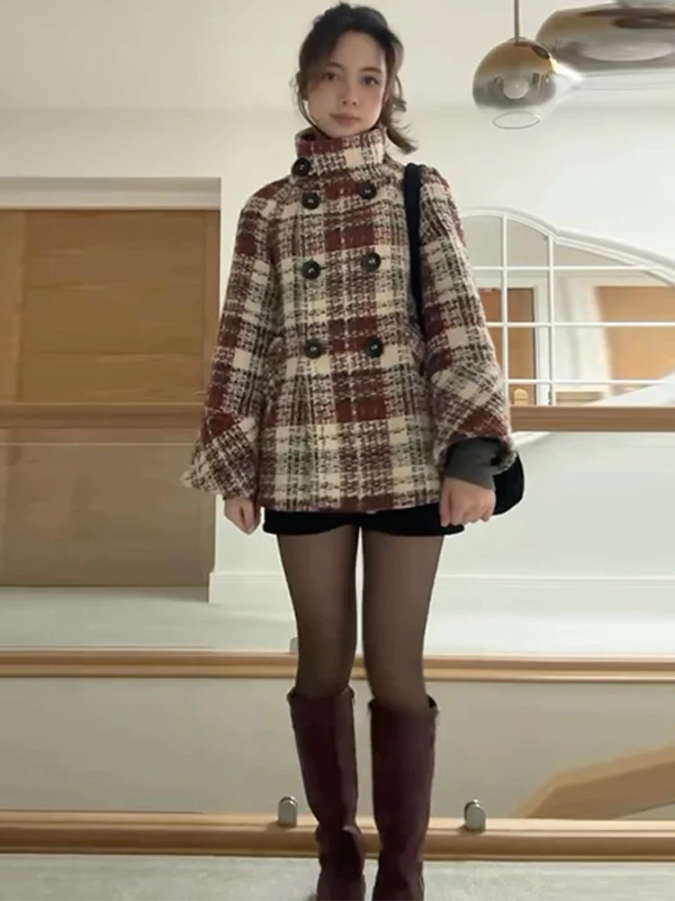 Rose checked wool-blend coat featuring a double-breasted front, high stand collar and softly flared sleeves. Warm beige and burgundy check with a textured finish; a feminine, vintage-leaning silhouette ideal for autumn and winter styling with boots or trousers.