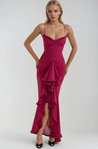 Ruffled bodycon gown with spaghetti straps in lightweight polyester blend, featuring ruched waist, cascading ruffle hem, and high slit. Elegant neckline and sleek silhouette ideal for formal events and cocktail evenings.