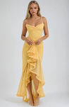 Ruffled bodycon gown with spaghetti straps in lightweight polyester blend, featuring ruched waist, cascading ruffle hem, and high slit. Elegant neckline and sleek silhouette ideal for formal events and cocktail evenings.