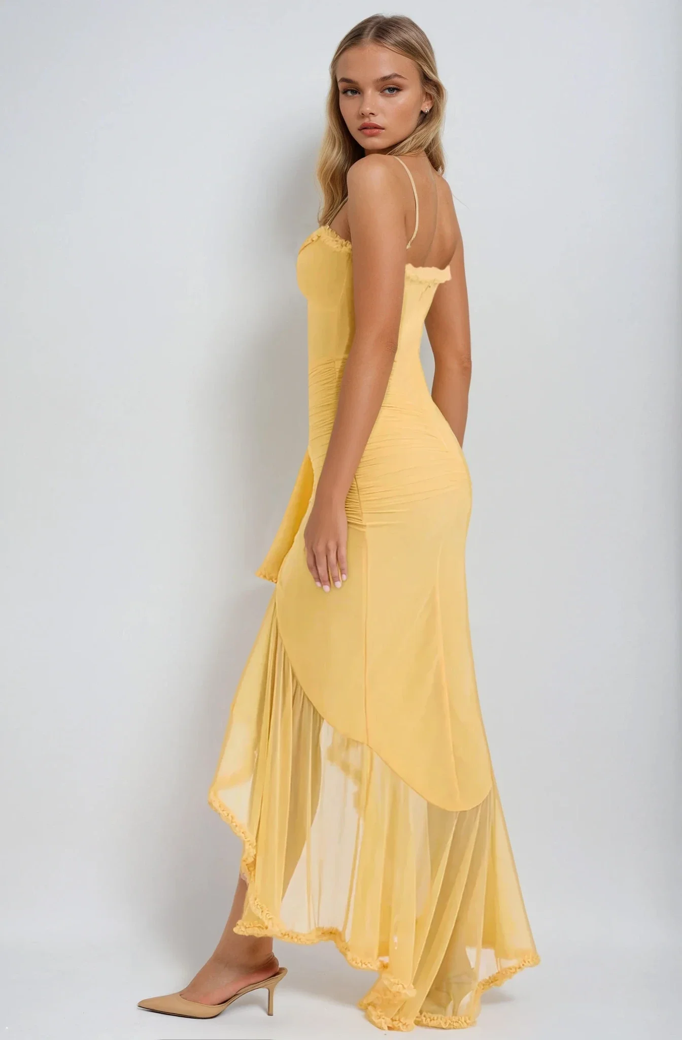 Ruffled bodycon gown with spaghetti straps in lightweight polyester blend, featuring ruched waist, cascading ruffle hem, and high slit. Elegant neckline and sleek silhouette ideal for formal events and cocktail evenings.