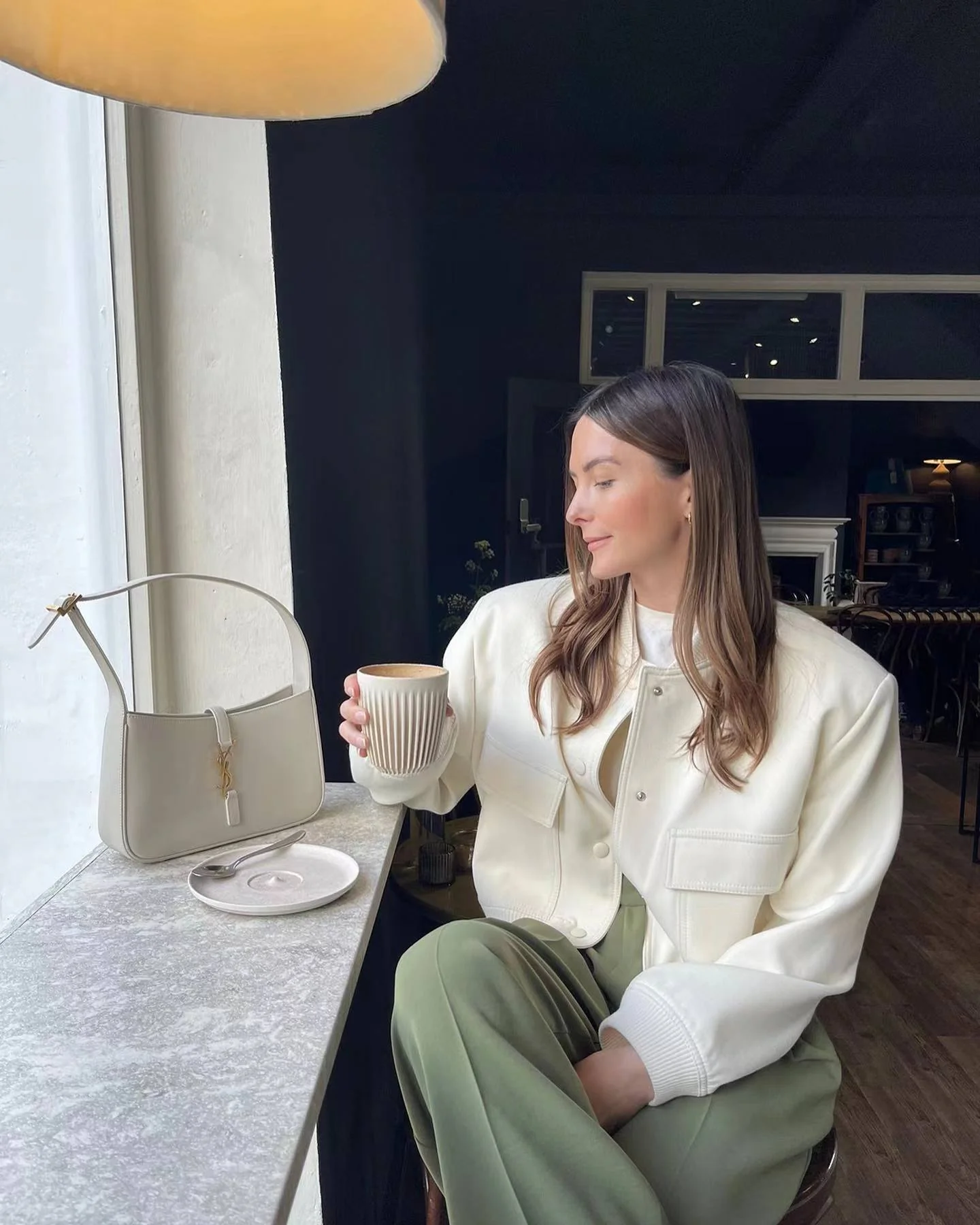 Oversized bomber jacket featuring a ribbed stand collar, ribbed cuffs and hem, clean snap-button front and two large flap pockets. Soft-touch, lightweight feel and relaxed drape make an easy, refined layer over tees, knits or dresses for transitional weather.