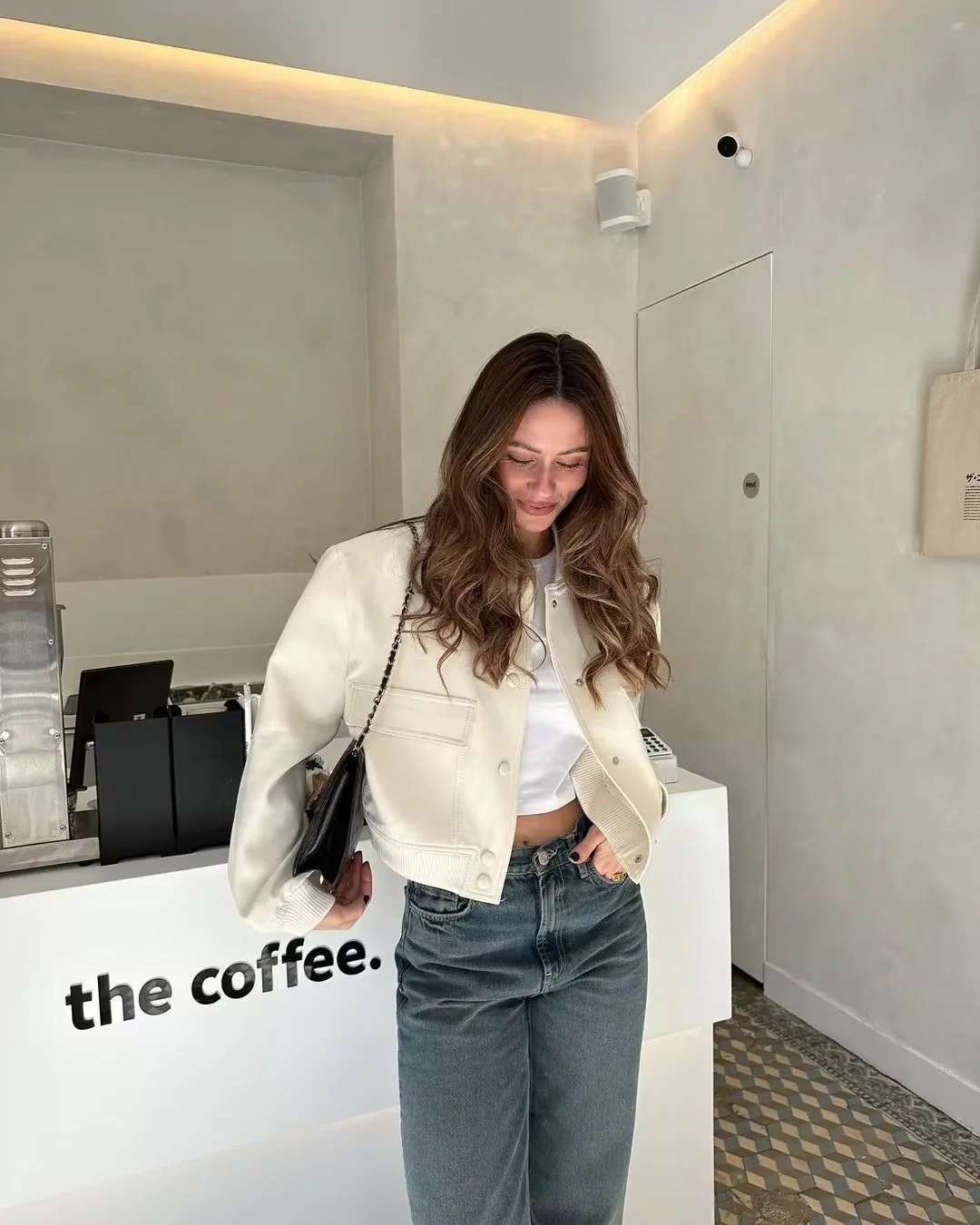 Oversized bomber jacket featuring a ribbed stand collar, ribbed cuffs and hem, clean snap-button front and two large flap pockets. Soft-touch, lightweight feel and relaxed drape make an easy, refined layer over tees, knits or dresses for transitional weather.