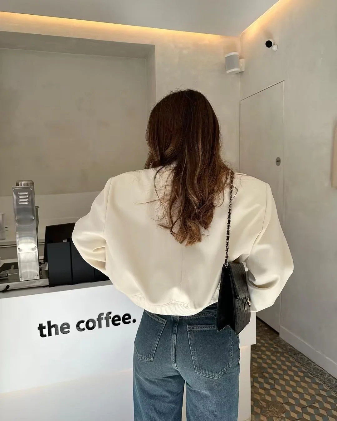 Oversized bomber jacket featuring a ribbed stand collar, ribbed cuffs and hem, clean snap-button front and two large flap pockets. Soft-touch, lightweight feel and relaxed drape make an easy, refined layer over tees, knits or dresses for transitional weather.