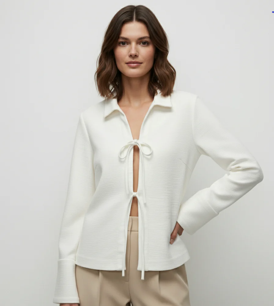 Sharon lightweight tie-front jacket in cotton-blend knit featuring a pointed collar, soft open front with fabric ties, flared sleeves and a clean, cropped silhouette. Minimal, refined layer to wear over tees, blouses or dresses for day-to-evening looks.