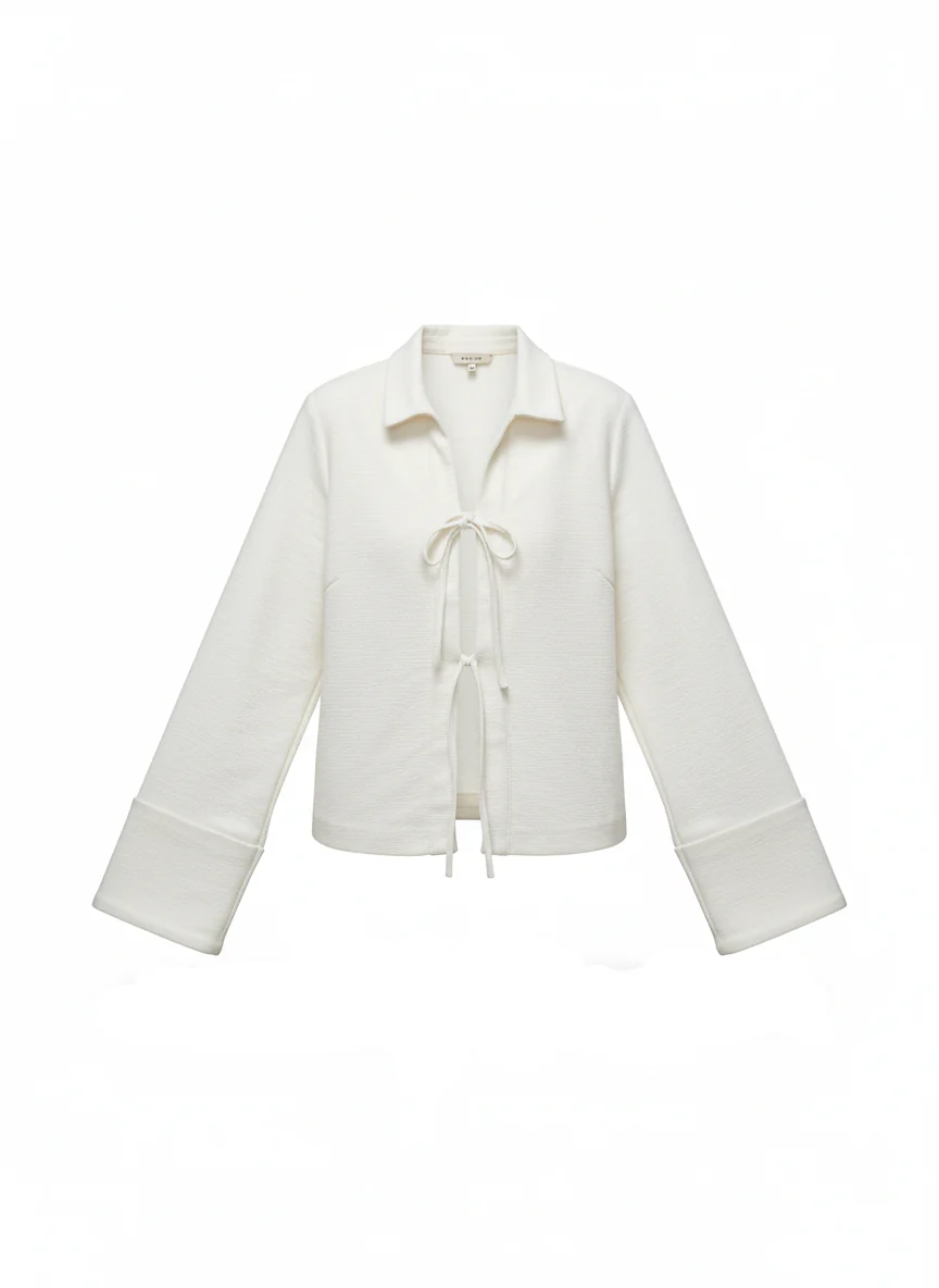 Sharon lightweight tie-front jacket in cotton-blend knit featuring a pointed collar, soft open front with fabric ties, flared sleeves and a clean, cropped silhouette. Minimal, refined layer to wear over tees, blouses or dresses for day-to-evening looks.