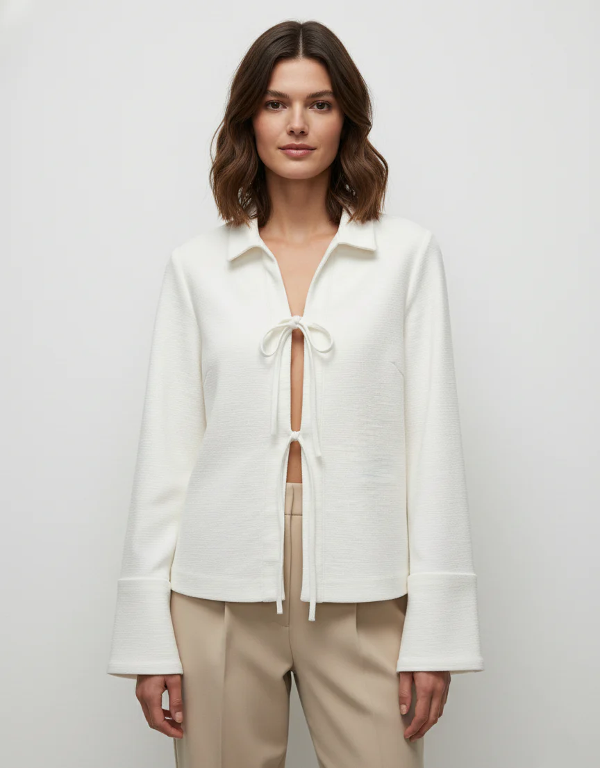 Sharon lightweight tie-front jacket in cotton-blend knit featuring a pointed collar, soft open front with fabric ties, flared sleeves and a clean, cropped silhouette. Minimal, refined layer to wear over tees, blouses or dresses for day-to-evening looks.