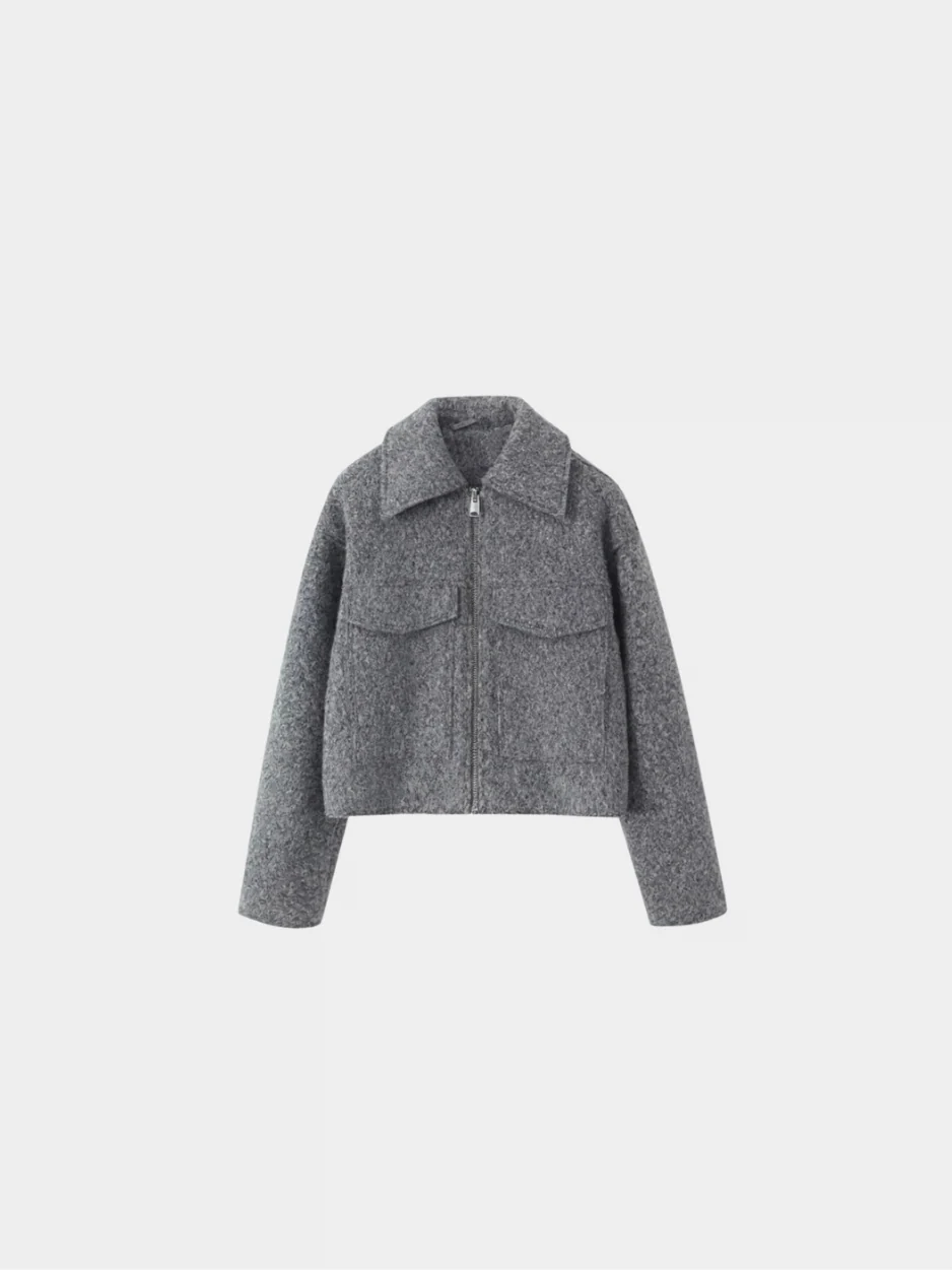 Sophie grey wool-blend cropped jacket featuring a slightly oversized cut, zip-up front and two flap pockets. Modern, waist-skimming silhouette designed for easy layering over knits or tees and effortless pairing with jeans, skirts or tailored trousers.