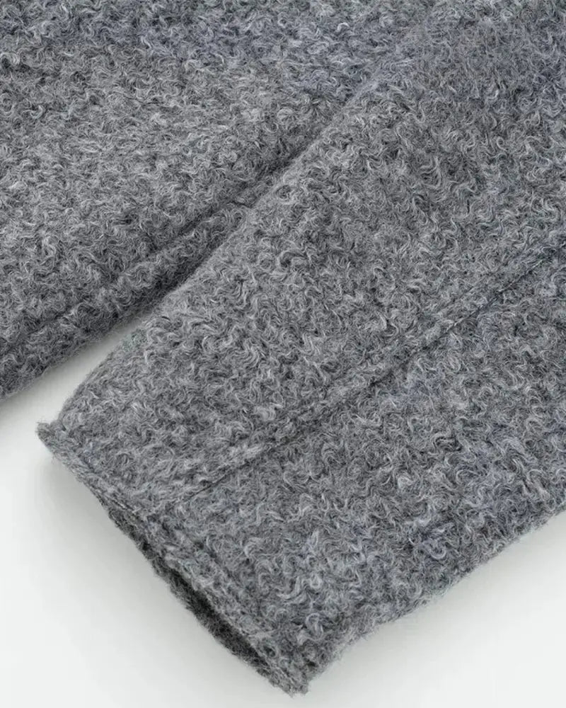 Sophie grey wool-blend cropped jacket featuring a slightly oversized cut, zip-up front and two flap pockets. Modern, waist-skimming silhouette designed for easy layering over knits or tees and effortless pairing with jeans, skirts or tailored trousers.