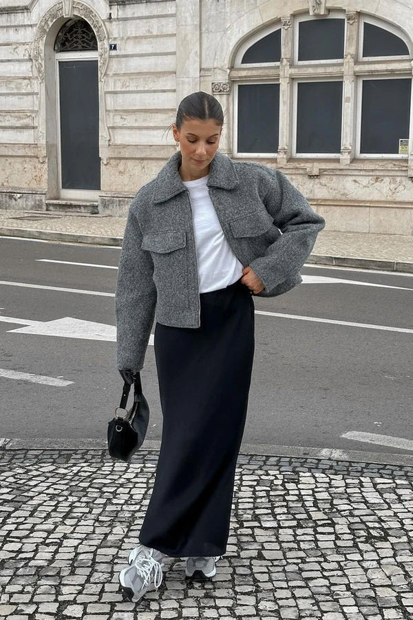 Sophie grey wool-blend cropped jacket featuring a slightly oversized cut, zip-up front and two flap pockets. Modern, waist-skimming silhouette designed for easy layering over knits or tees and effortless pairing with jeans, skirts or tailored trousers.