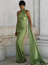 Stella Timeless Cape Gown in lustrous satin featuring a dramatic one-shoulder cape, built-in bra, and sculpted mermaid silhouette with a sweeping train. Contoured seams define the waist and hips for a polished, statement look at formal events.