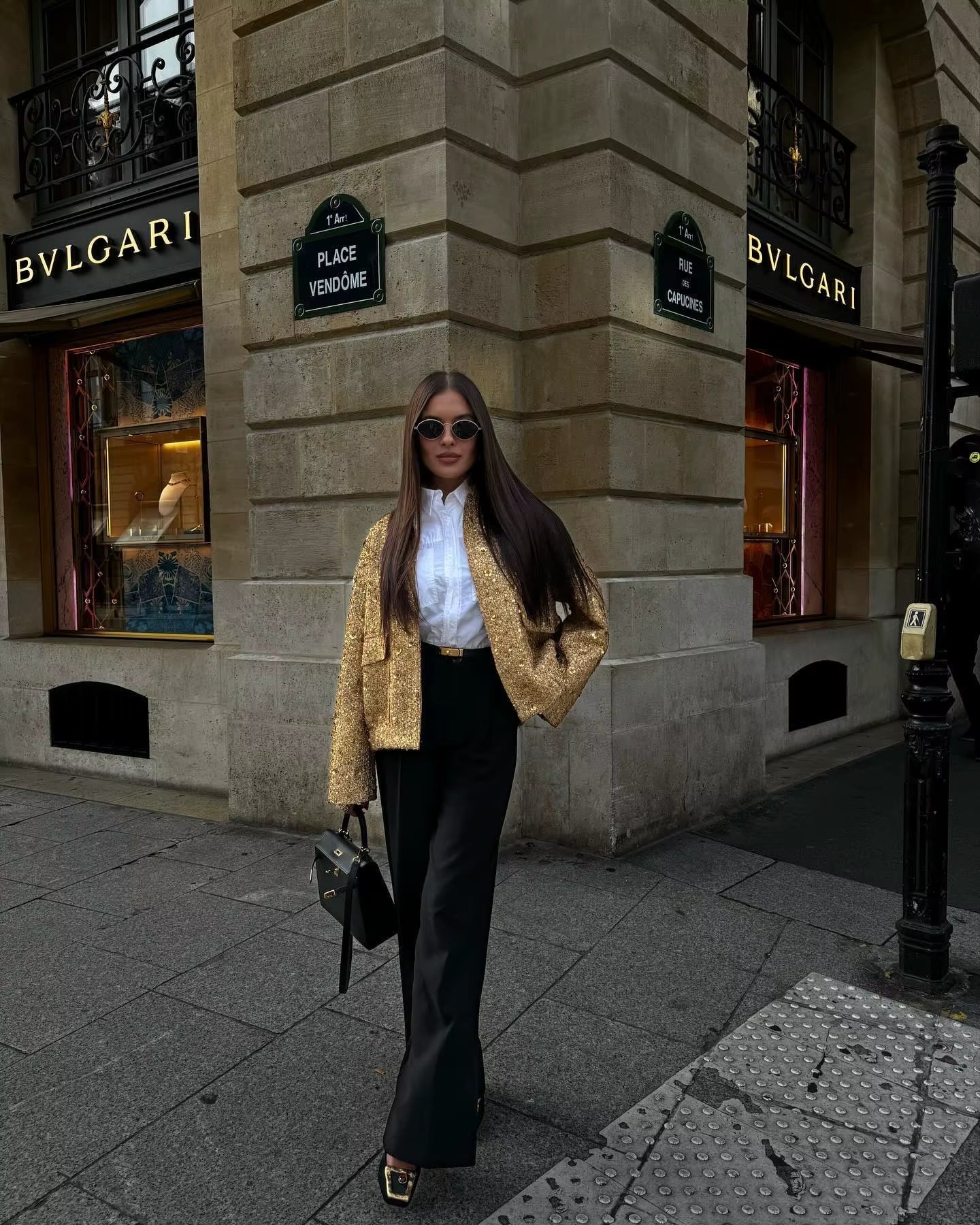 Oversized sequin jacket featuring a modern stand collar, concealed snap-button front, flap cargo pockets plus side pockets, and an elastic ruched hem. A clean, polished silhouette that adds statement sparkle over denim, trousers or a sleek dress.