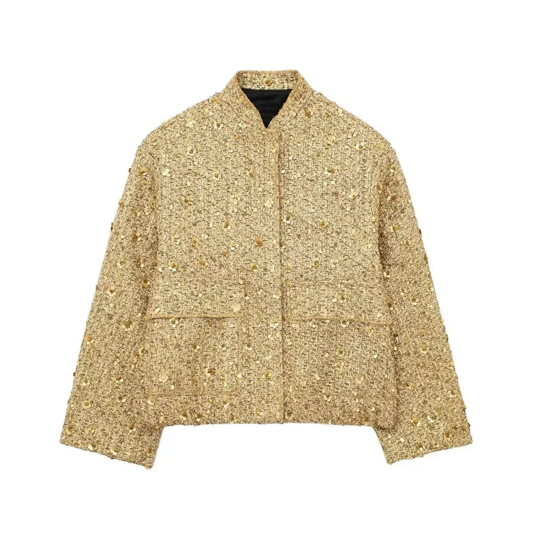 Oversized sequin jacket featuring a modern stand collar, concealed snap-button front, flap cargo pockets plus side pockets, and an elastic ruched hem. A clean, polished silhouette that adds statement sparkle over denim, trousers or a sleek dress.