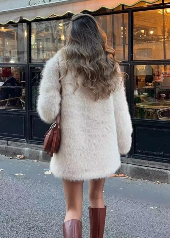 Women’s off-white faux-fur coat featuring a plush exterior, smooth lining and a clean, flattering silhouette. Lightweight yet warm, it layers effortlessly over dresses, knits or casual outfits—an elegant lined winter jacket for day or night.