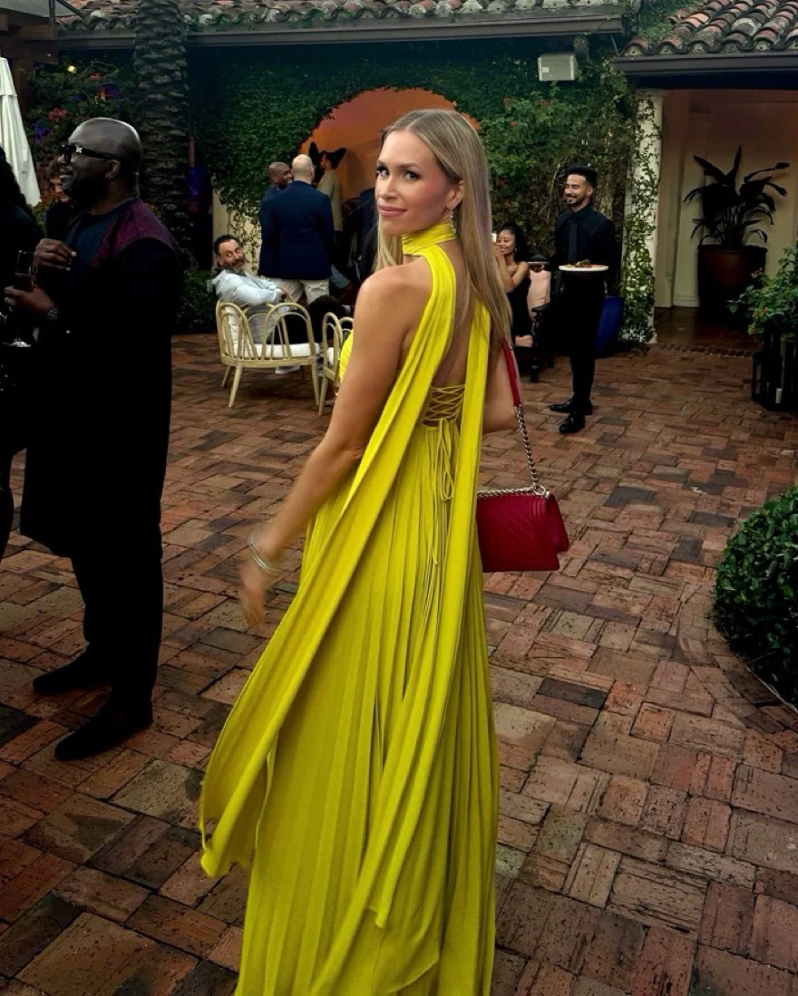 Zaira strapless pleated maxi dress featuring a sweetheart neckline, subtly structured bust and fitted bodice with adjustable side ties. Crafted from breathable 100% polyester, the elegant pleats flow and elongate—perfect for weddings, garden parties and evening cocktails.