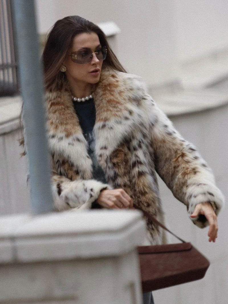 Oversized faux-fur jacket in a plush, spotted finish featuring a high collar, discreet front closure, cuffed sleeves and hidden pockets. Voluminous yet comfortable silhouette adds statement warmth over denim, knits or evening pieces.