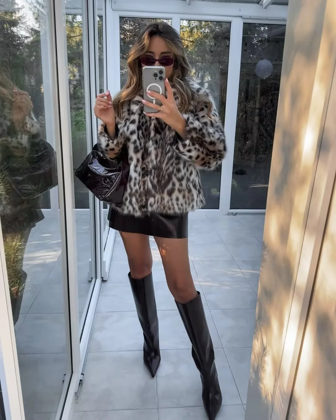 Oversized faux-fur jacket in a plush, spotted finish featuring a high collar, discreet front closure, cuffed sleeves and hidden pockets. Voluminous yet comfortable silhouette adds statement warmth over denim, knits or evening pieces.