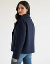Maya wool-blend double-breasted cropped trench coat in a tailored silhouette with wide lapels and structured shoulders. Warm, durable and comfortable layer for autumn and winter, styled with denim, skirts or trousers.