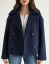 Maya wool-blend double-breasted cropped trench coat in a tailored silhouette with wide lapels and structured shoulders. Warm, durable and comfortable layer for autumn and winter, styled with denim, skirts or trousers.